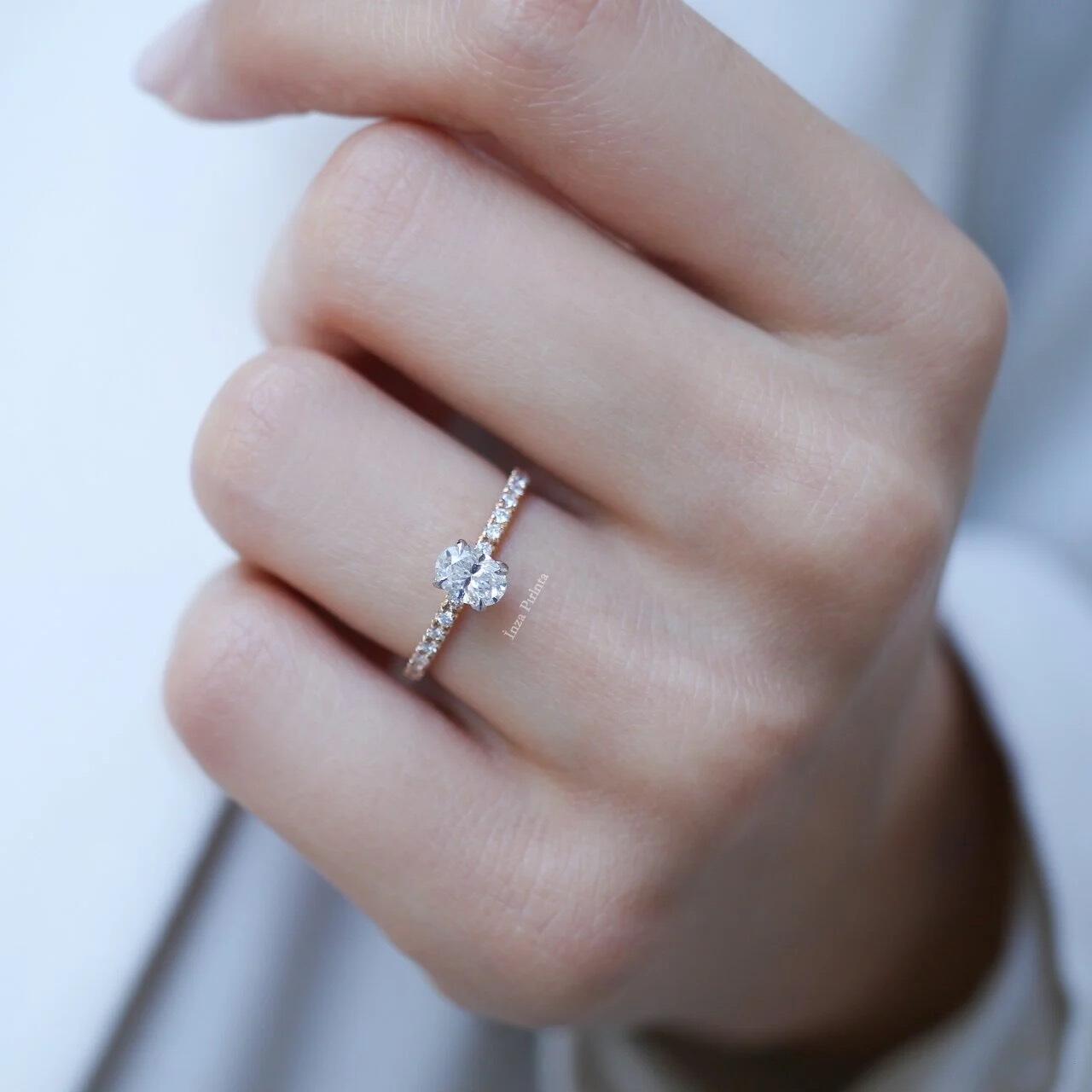 0.70 Carat Oval Diamond Solitaire Ring with Side Stones