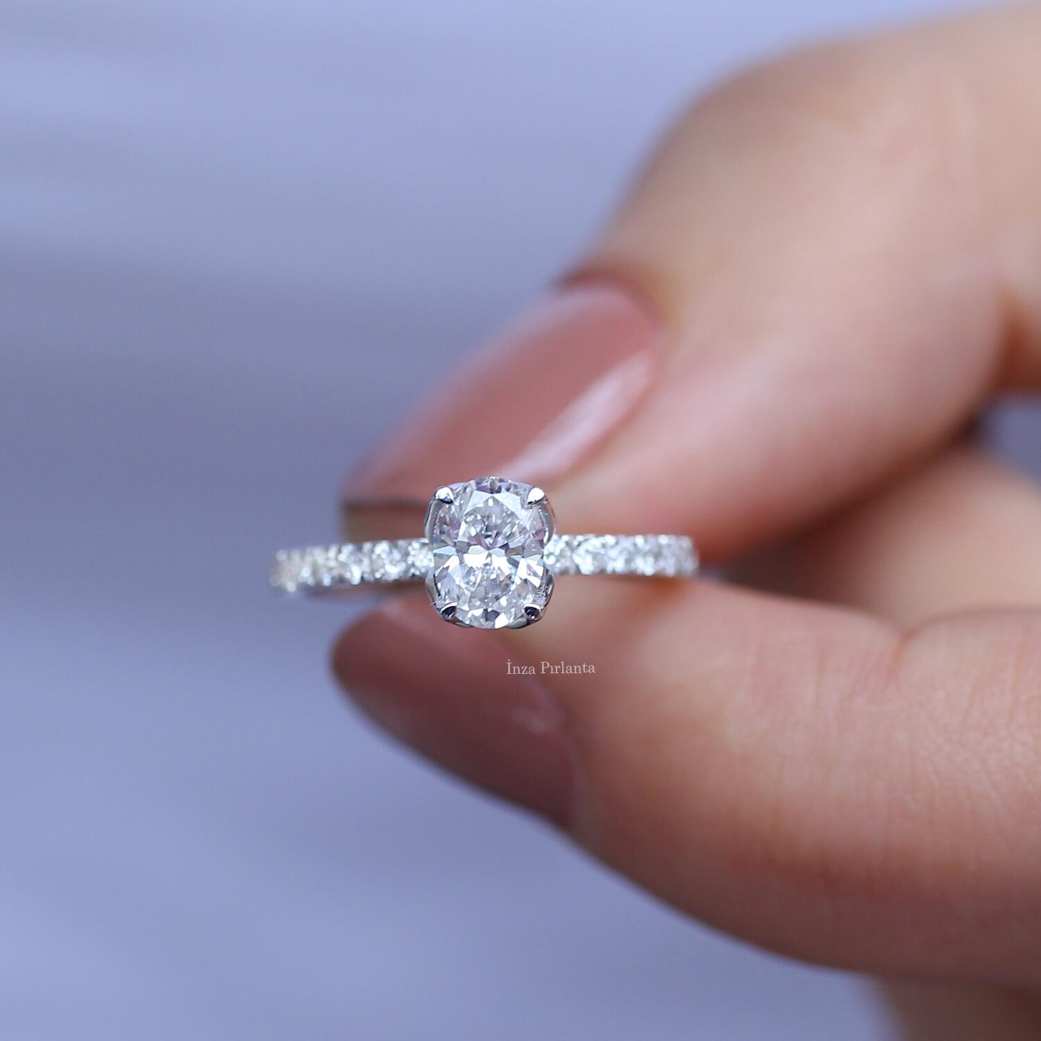 0.70 Carat Oval Diamond Solitaire Ring with Side Stones