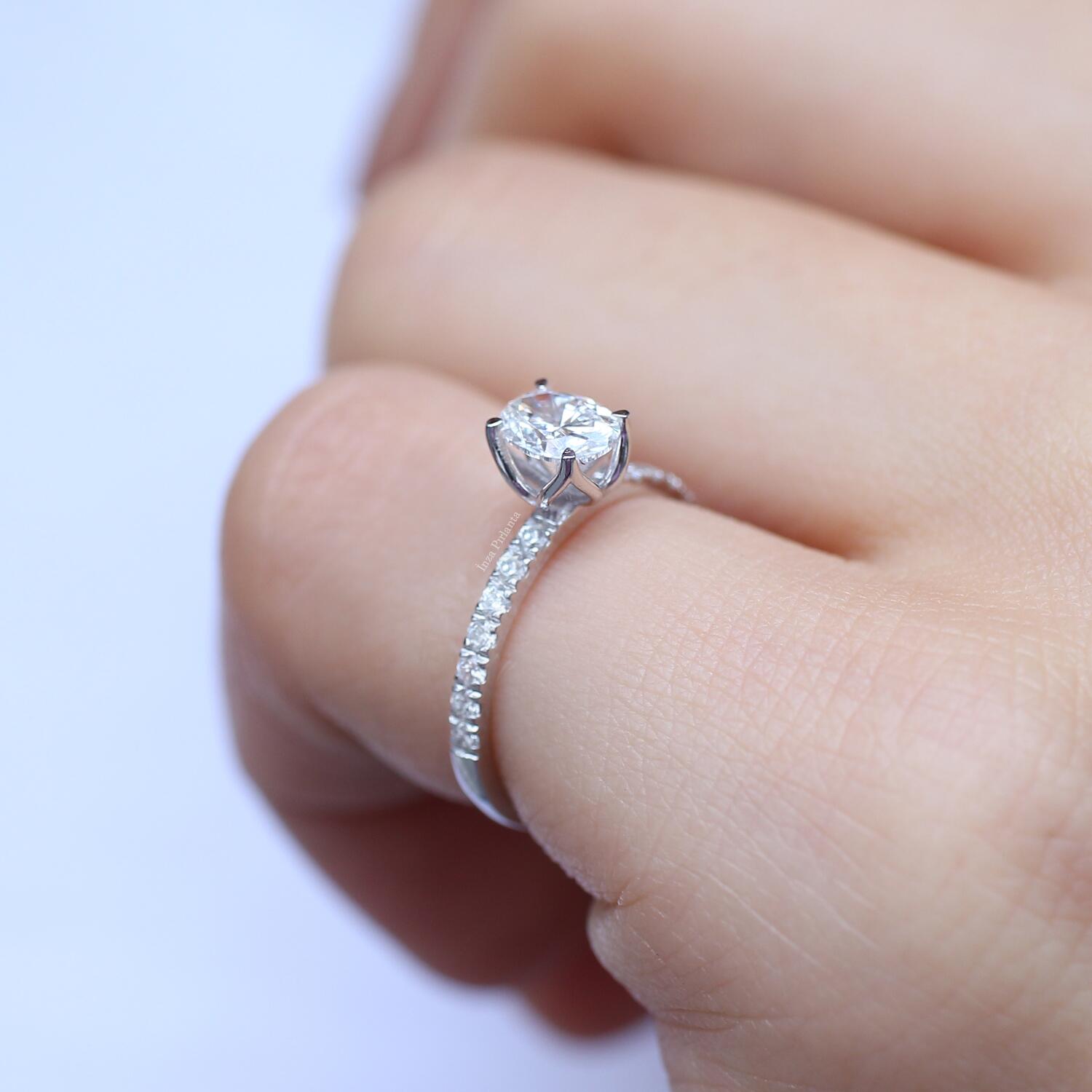 0.70 Carat Oval Diamond Solitaire Ring with Side Stones
